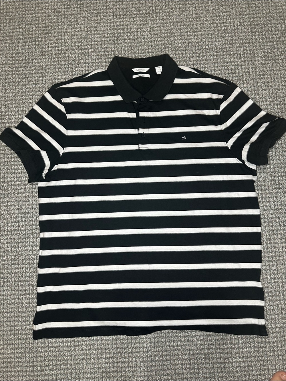 Calvin Klein Men’s Black and White Striped Polo